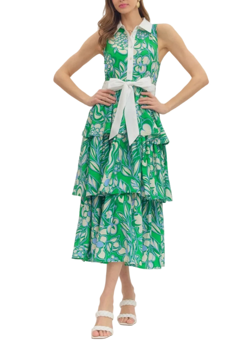 Botanical print sleeveless tiered midi dress featuring contrast collar placket. Button closure at front. Self-tie belt at waist. Side pockets. Lined. Woven. Non-sheer. Lightweight.
