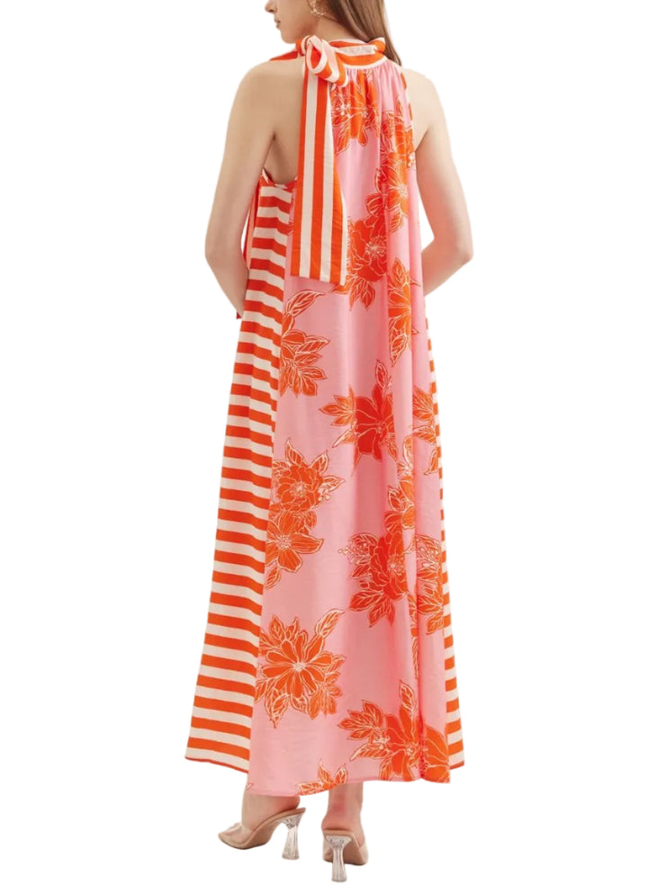 Botanical print sleeveless midi dress featuring contrast striped tie neck. Self tie closure at neck. Side pockets. Lined. Woven. Non-sheer. Lightweight.
