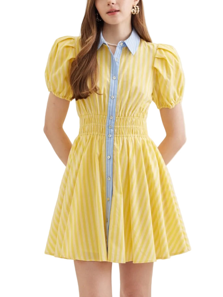 Stripe print short puff sleeve mini dress featuring smocked waist detail. Button closure at front. Elasticated sleeve openings. Pocket at side. Lined. Woven. Non-sheer. Lightweight.