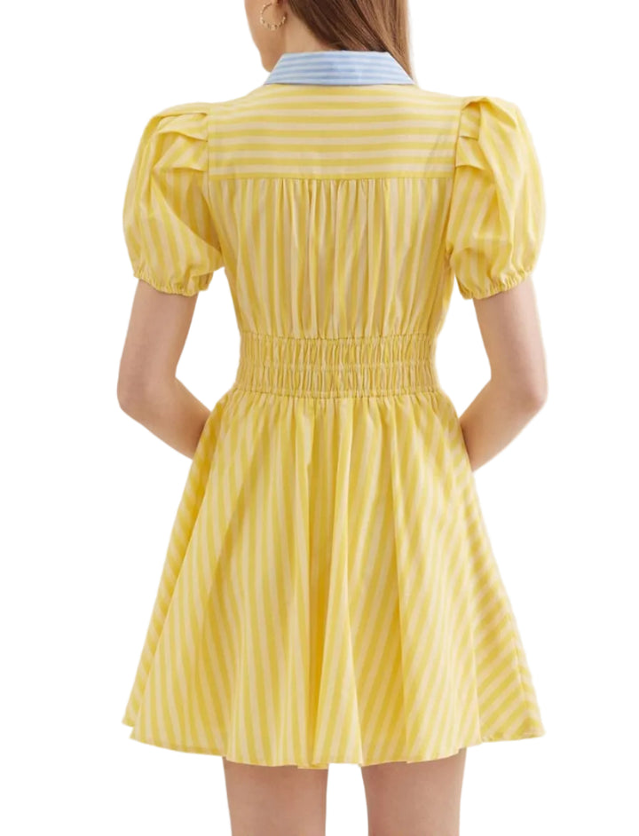 Stripe print short puff sleeve mini dress featuring smocked waist detail. Button closure at front. Elasticated sleeve openings. Pocket at side. Lined. Woven. Non-sheer. Lightweight.