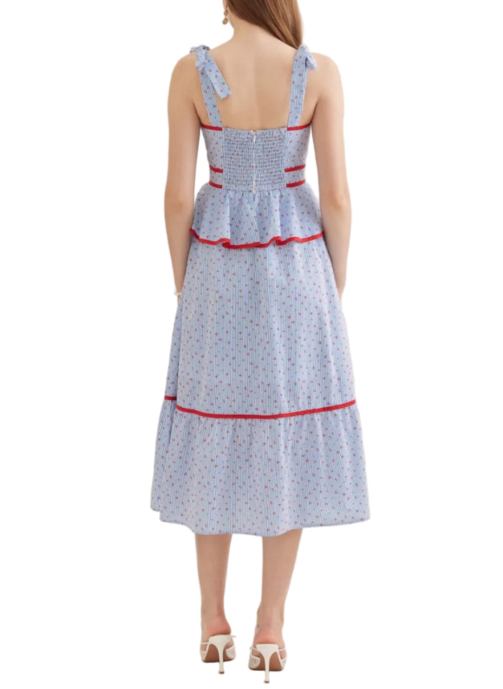 Striped sleeveless midi dress featuring peplum waist detail. Self-tie shoulder straps. Nonfunctional button detail at front bodice. Smocked back. Zipper closure at back. Side pockets. Lined. Woven. Non-sheer. Lightweight.