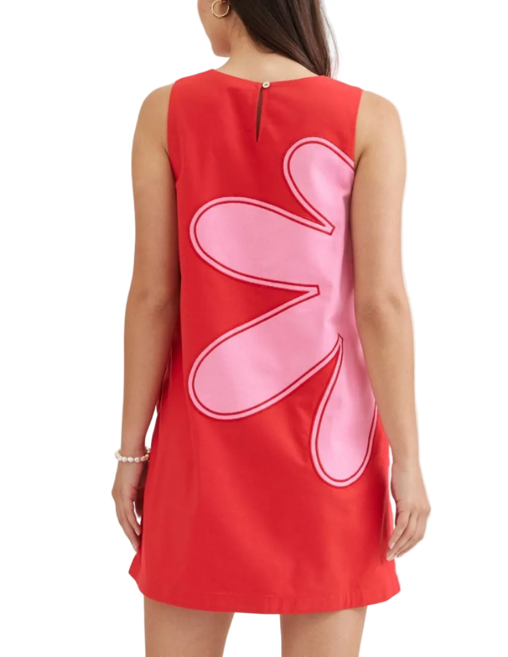 Effortless elegance meets practical design in this sleeveless mini dress. The solid silhouette is elevated by striking contrast appliqué detail, while a button closure at the back neck adds a refined touch. A convenient side zip and hidden side pockets make this piece as functional as it is stylish. Fully lined for comfort and crafted from lightweight woven fabric that moves with you.&amp;nbsp;