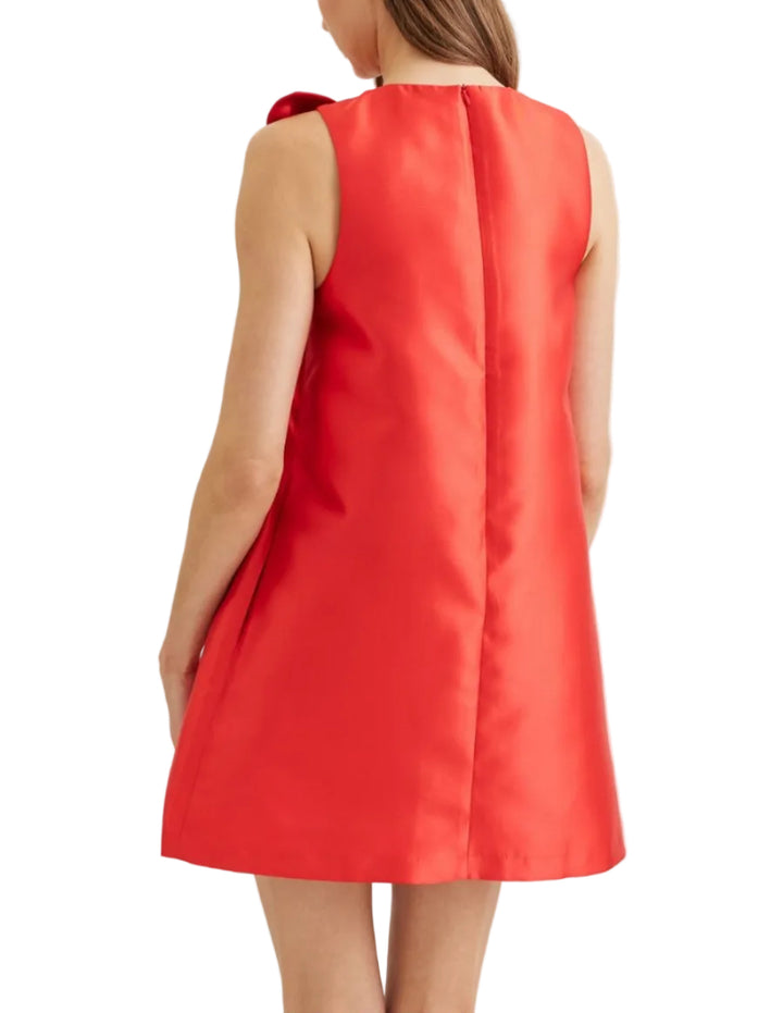 Solid sleeveless mini dress featuring twisted bow detail at neckline. Round neckline. Zipper closure at back. Side pockets. Lined. Woven. Non-sheer. Lightweight.