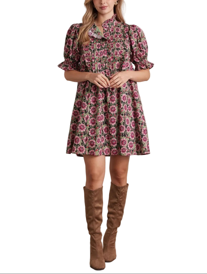 Floral print ruffled neck short puff sleeve mini dress featuring pleated front detail. Button closure at front. Side pockets. Lined. Woven. Non-sheer. Lightweight.