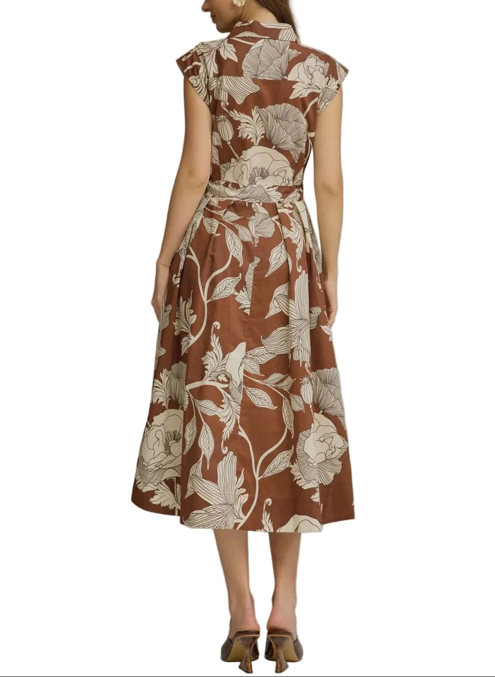 Effortless elegance meets timeless style with the Shannon Floral Midi Dress. This versatile piece features a charming floral print on a rich brown base, perfect for transitional seasons and layered styling. The self-tie belt cinches at the waist to create a flattering silhouette you can customize to your comfort. Ideal for brunch, casual outings, or dressed up for evening occasions. A wardrobe essential that works as hard as you do.