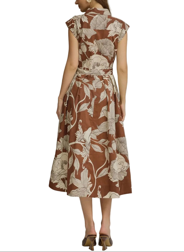Effortless elegance meets timeless style with the Shannon Floral Midi Dress. This versatile piece features a charming floral print on a rich brown base, perfect for transitional seasons and layered styling. The self-tie belt cinches at the waist to create a flattering silhouette you can customize to your comfort. Ideal for brunch, casual outings, or dressed up for evening occasions. A wardrobe essential that works as hard as you do.