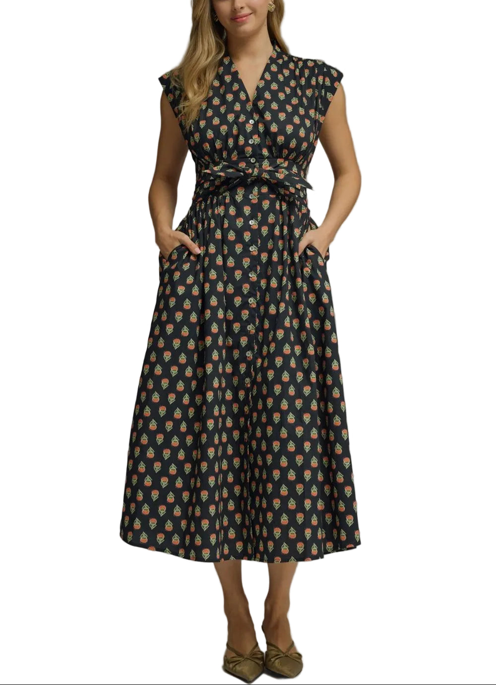 Geo print sleeveless midi dress featuring elasticated waist with self-tie detail. Button closure at front. Side pockets. Lined. Woven. Non-sheer. Lightweight.