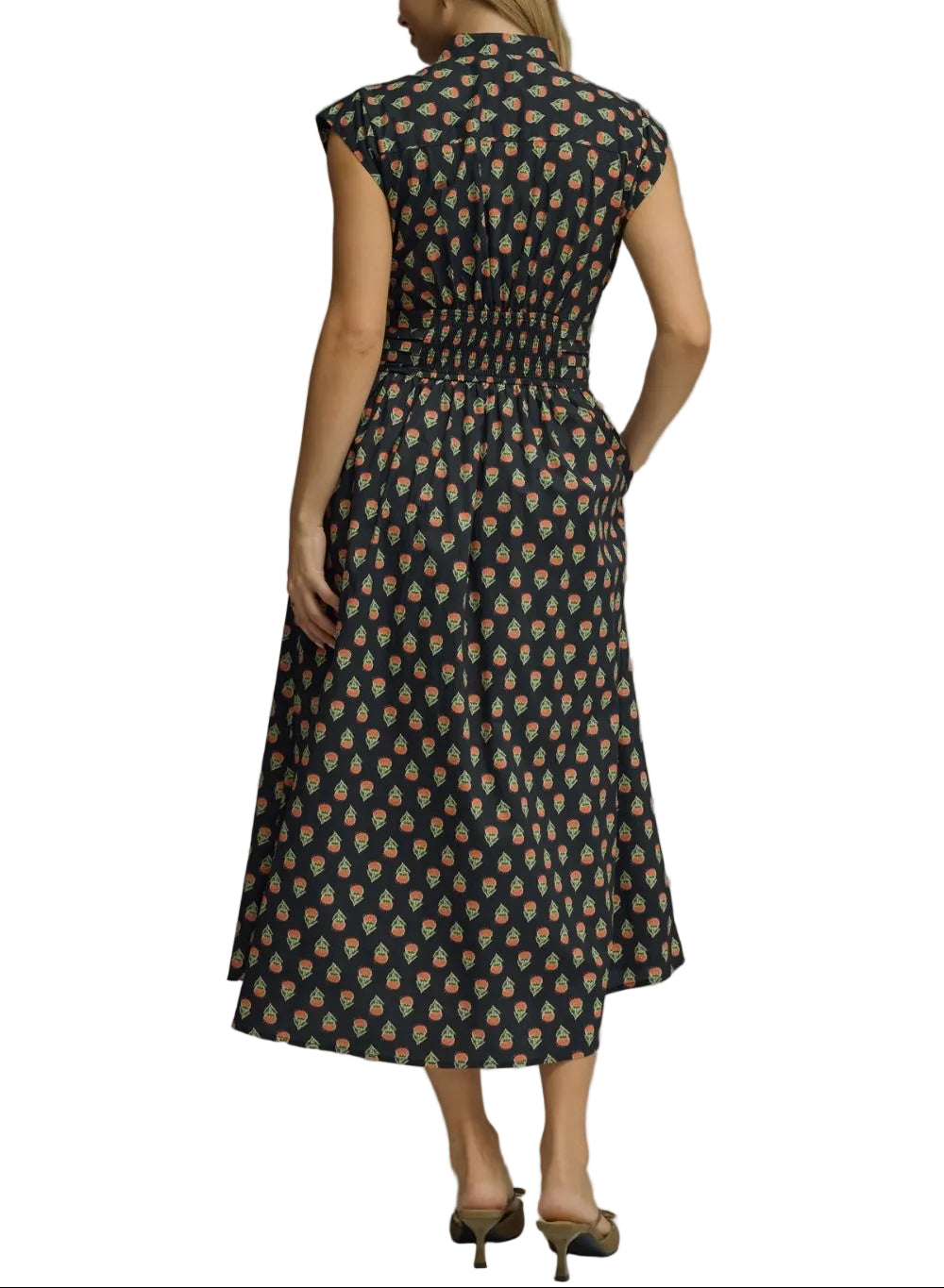 Geo print sleeveless midi dress featuring elasticated waist with self-tie detail. Button closure at front. Side pockets. Lined. Woven. Non-sheer. Lightweight.