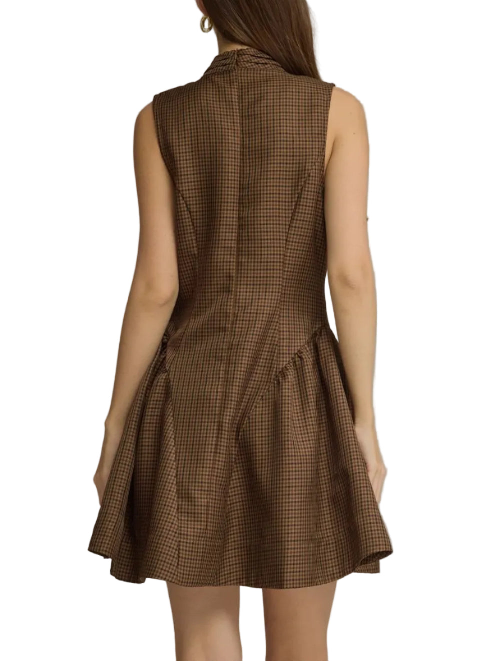 A woman shown from the back wearing a sleeveless brown mini dress with a fine black grid pattern, set against a plain gray studio background.