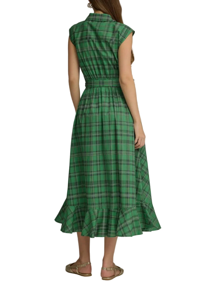 A woman viewed from the back wearing a green plaid sleeveless midi dress with a ruffled hem, paired with tan sandals, against a neutral gray studio background.