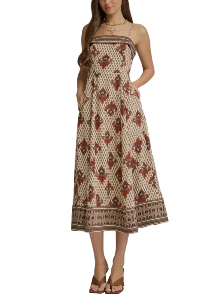 Ornamental print sleeveless midi dress featuring a straight neckline and border print detailing. Smocked back. Lined. Woven. Non-sheer. Lightweight.
