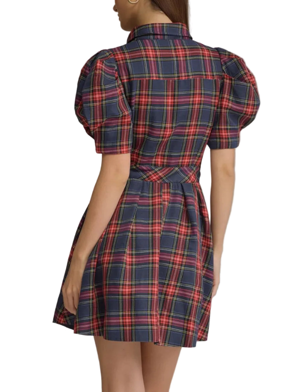 A woman shown from the back wearing a short puff-sleeve plaid dress in navy, red, and green, photographed against a plain gray studio background.