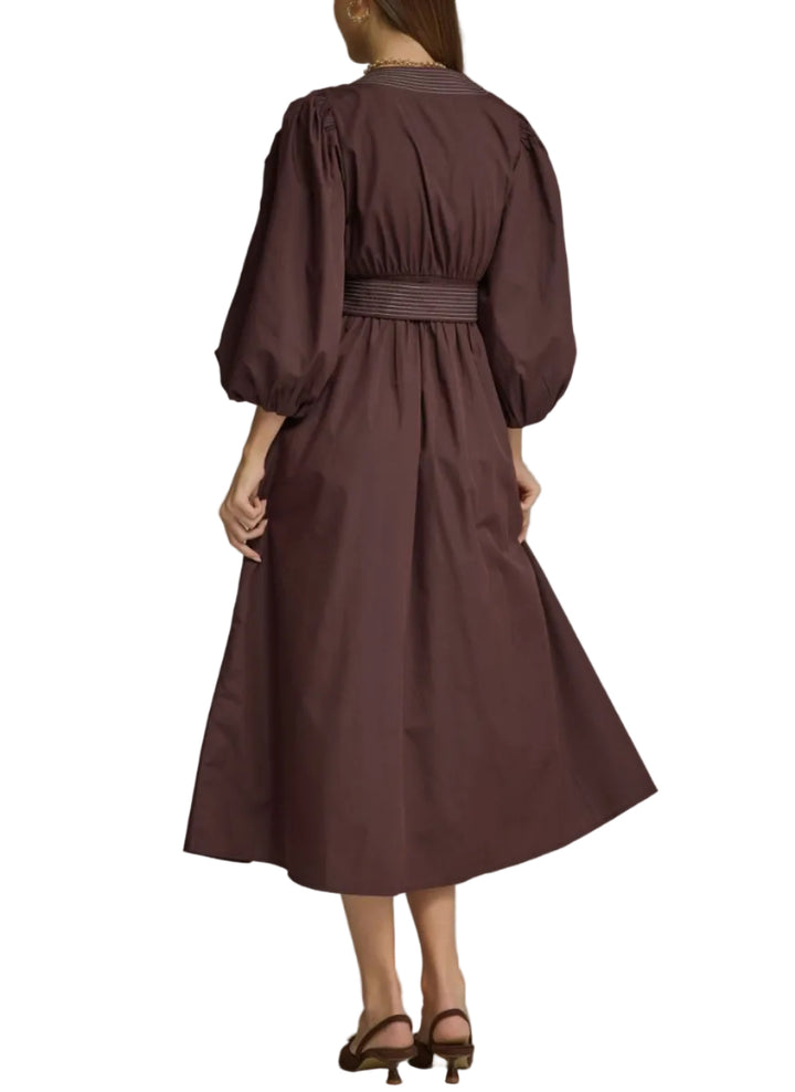 Solid long puff sleeve midi dress with a V-neck and wrap front detail. Contrast stripe trim detail at neckline, front, and self-tie belt. Side pockets. Lined. Woven. Non-sheer. Lightweight.