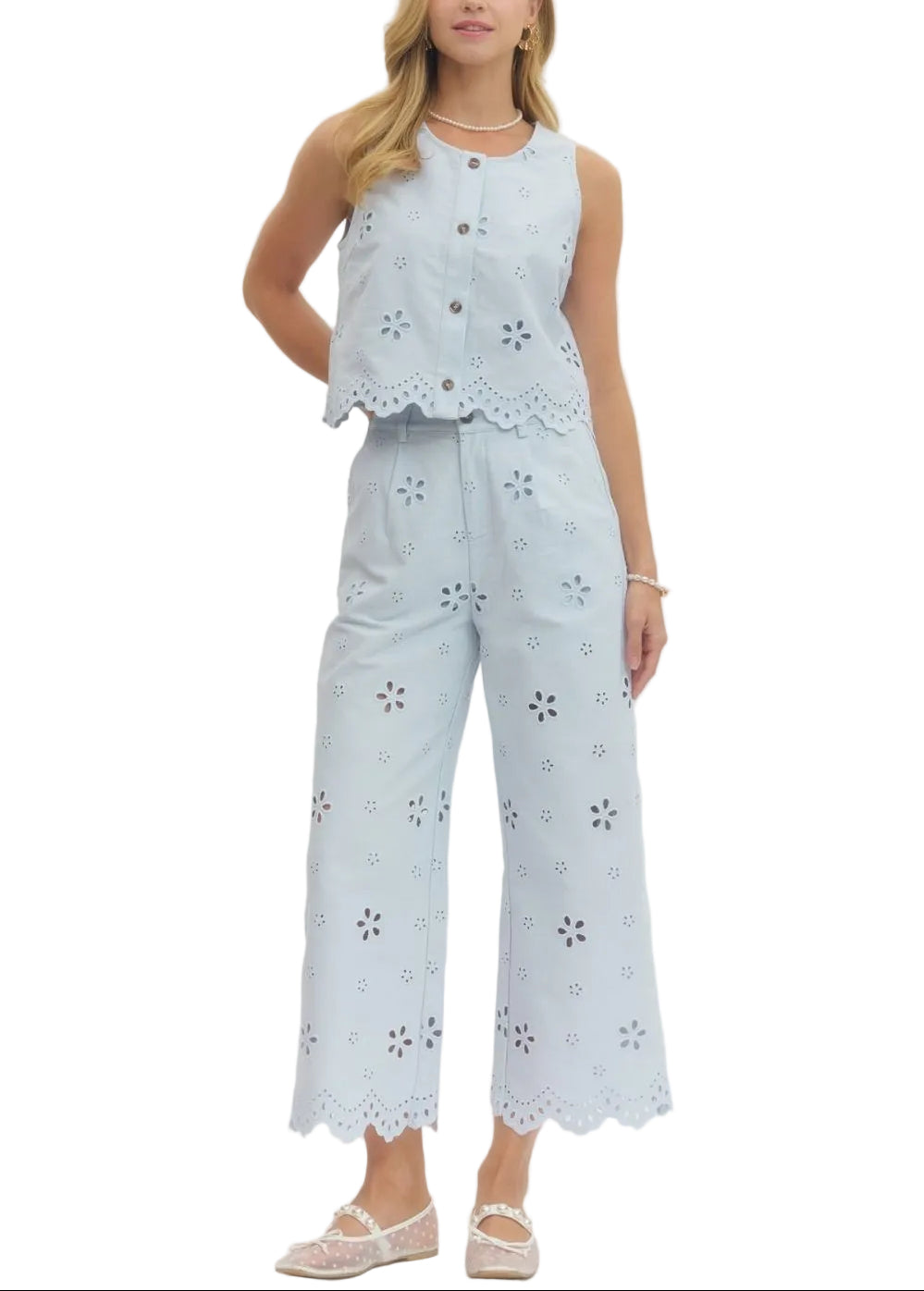 Effortlessly chic and undeniably fun, this eyelet embroidered sleeveless crop top/pant set brings a touch of vintage charm to your everyday wardrobe. The delicate eyelet detailing adds texture and visual interest, while the scallop hem creates a flirty, feminine finish.