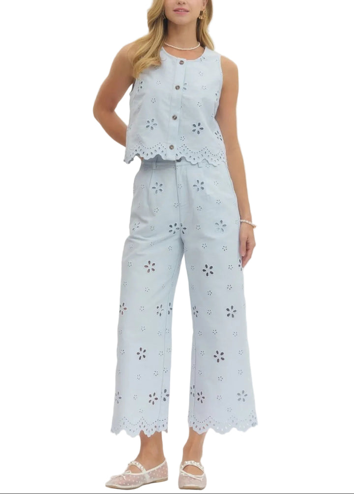 Effortlessly chic and undeniably fun, this eyelet embroidered sleeveless crop top/pant set brings a touch of vintage charm to your everyday wardrobe. The delicate eyelet detailing adds texture and visual interest, while the scallop hem creates a flirty, feminine finish.