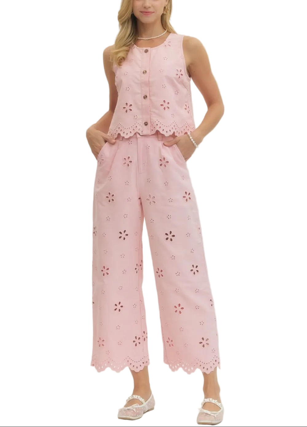 Effortlessly chic and undeniably fun, this eyelet embroidered sleeveless crop top/pant set brings a touch of vintage charm to your everyday wardrobe. The delicate eyelet detailing adds texture and visual interest, while the scallop hem creates a flirty, feminine finish.
