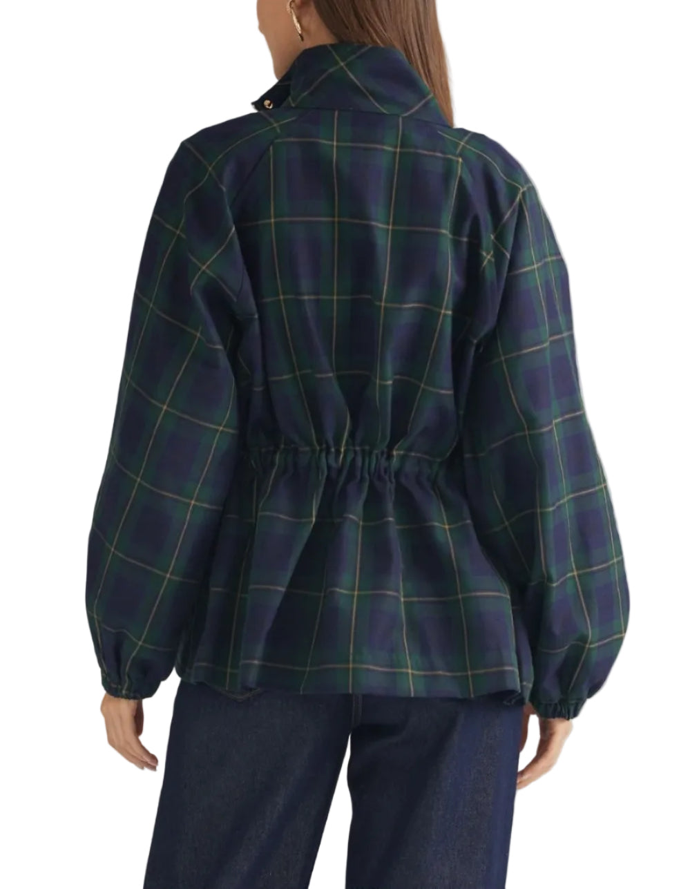 A woman shown from the back wearing a navy blue plaid jacket with green and yellow lines, featuring a high collar and a gathered elastic waist, paired with dark blue jeans against a light beige background.