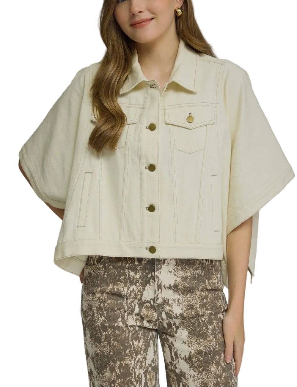 Solid denim short sleeve jacket featuring a snap button closure at front and chest pockets. Front pockets. Snap button closures at sides. Unlined. Woven. Non-sheer. Medium weight.