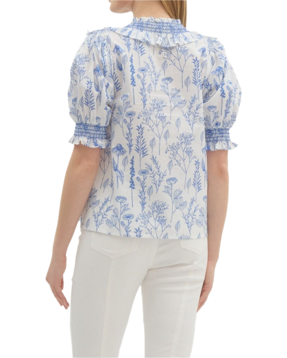 Print smock cuff elbow length sleeve pullover top featuring ruffle v-neck accented with smocked embroidery. Unlined. Woven. Non-sheer. Lightweight.