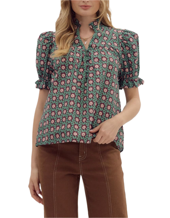 Floral pattern ruffle edge puff short sleeve V-neck pullover top. Unlined. Woven. Non-sheer. Lightweight.