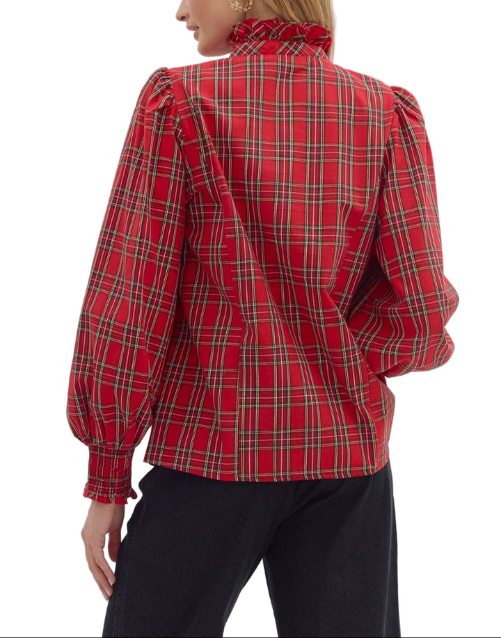 Plaid long sleeve blouse featuring ruffle-accented button-down front. High ruffle neck. Smocked elasticized cuffs. Unlined. Woven. Non-sheer. Lightweight.