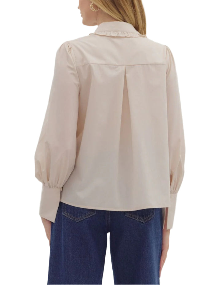 Solid long shirt sleeve collar button closure top featuring ruffle accent detailing. Unlined. Woven. Non-sheer. Lightweight.