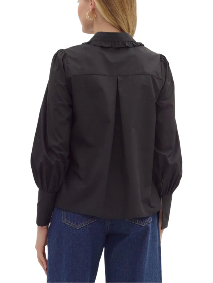 Solid long shirt sleeve collar button closure top featuring ruffle accent detailing. Unlined. Woven. Non-sheer. Lightweight.
