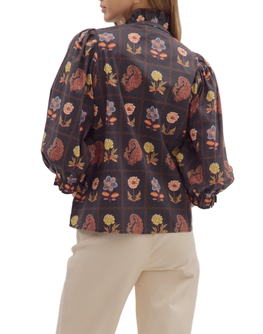Floral and paisley print 3/4 puff sleeve top featuring ruffled high neck and loop button closure at front. Elasticated sleeve openings with ruffle trim. Unlined. Woven. Non-sheer. Lightweight.
