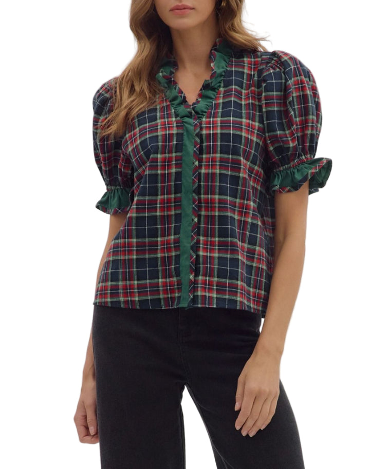 Plaid short puff sleeve top featuring contrast ruffle trim and snap button closure at bust. Unlined. Woven. Non-sheer. Lightweight.
