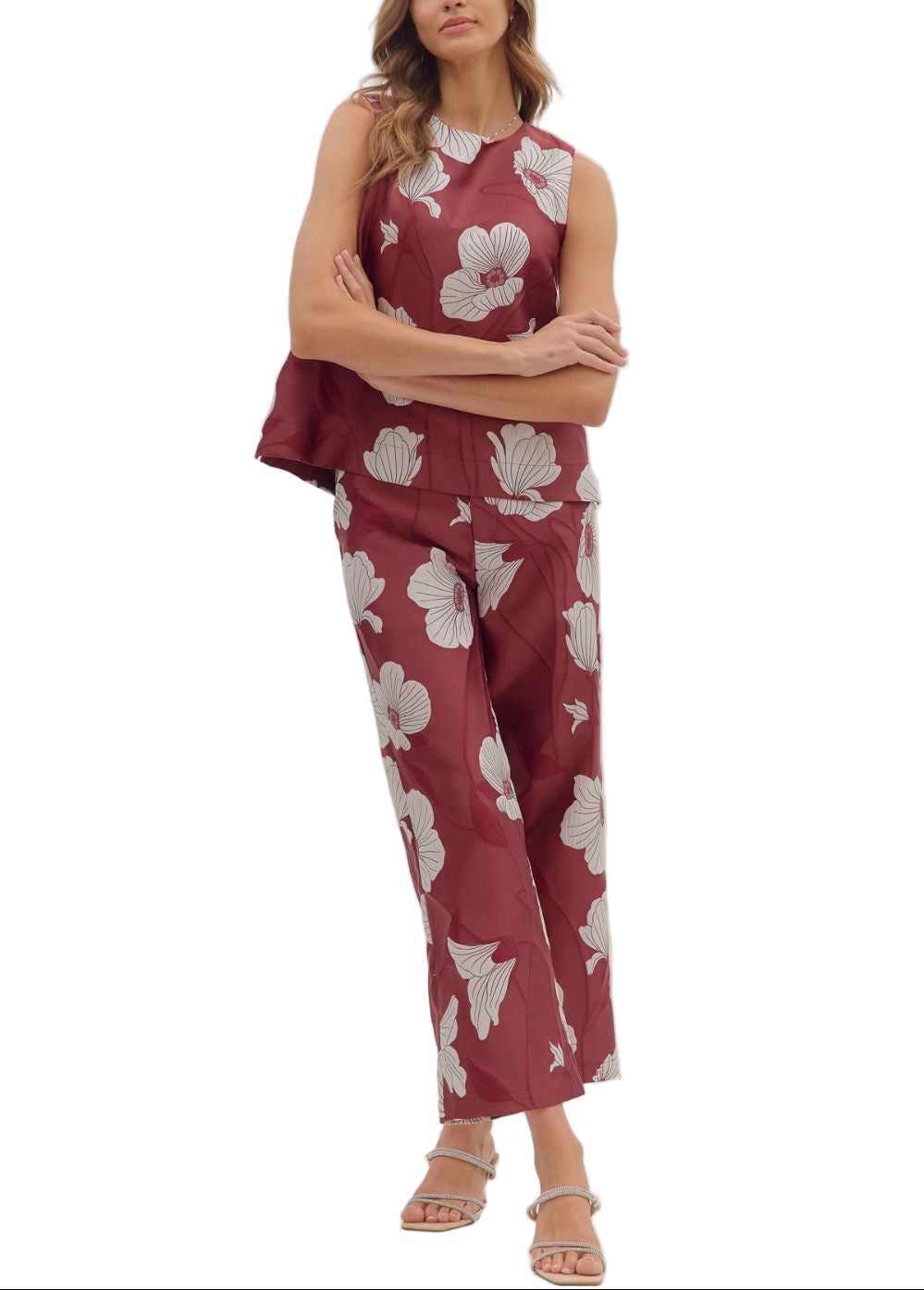 Brighten your wardrobe with the Betsy Pant Set—a fun floral sleeveless top paired perfectly with matching pants. This playful duo offers effortless style and comfort, ideal for sunny days or casual outings where you want to stand out with ease and charm.