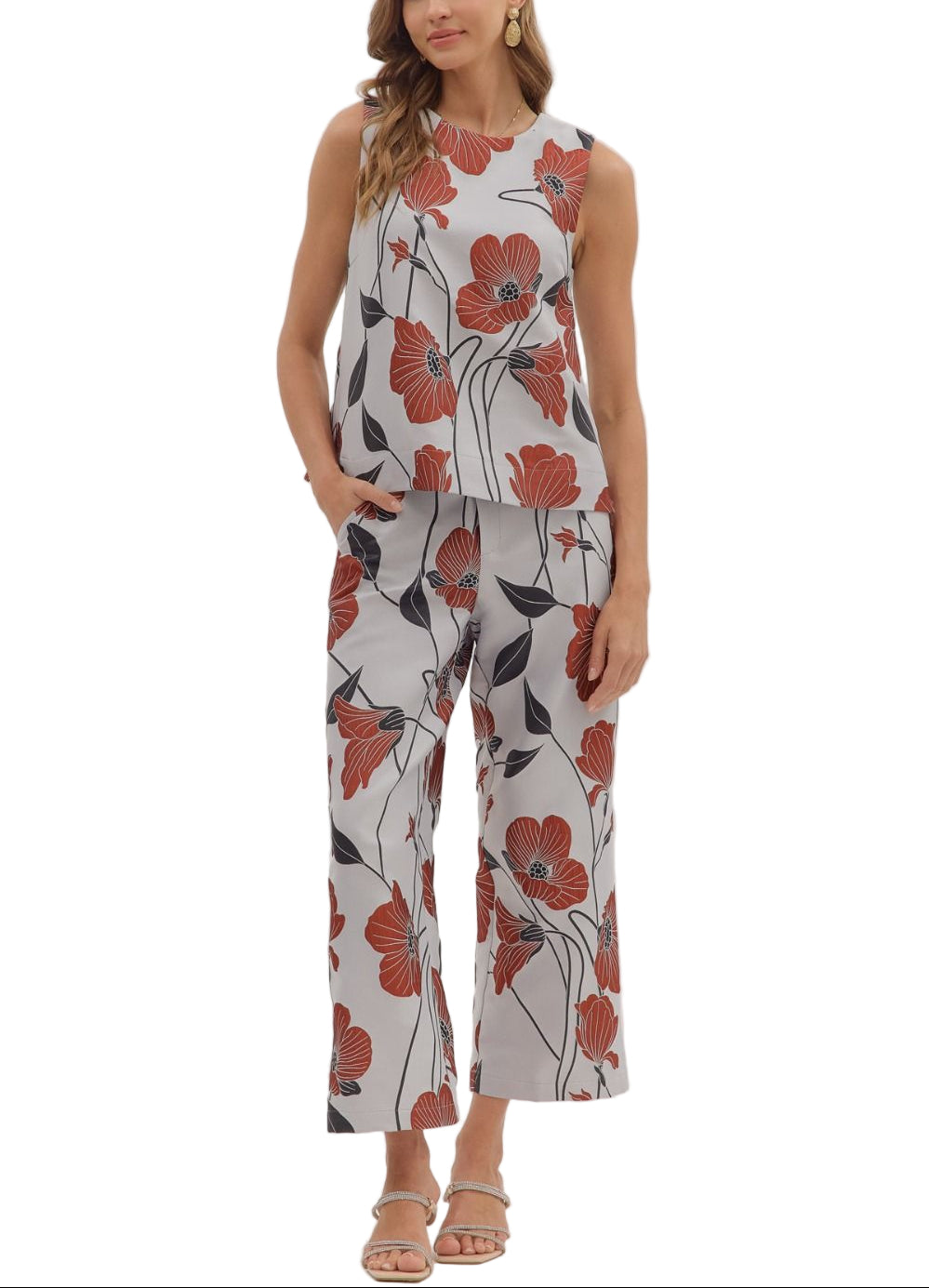 Brighten your wardrobe with the Betsy Pant Set—a fun floral sleeveless top paired perfectly with matching pants. This playful duo offers effortless style and comfort, ideal for sunny days or casual outings where you want to stand out with ease and charm.