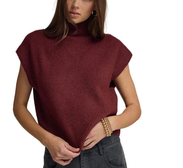 Effortless elegance meets everyday comfort in the Meredith Cap Sleeve Sweater. This versatile piece features charming cap sleeves that frame the shoulders beautifully, while the short sleeve length keeps you cool without sacrificing warmth. Perfect for layering or wearing solo, it transitions seamlessly from office to weekend. The classic silhouette pairs with everything in your wardrobe, making it an essential addition to any closet.