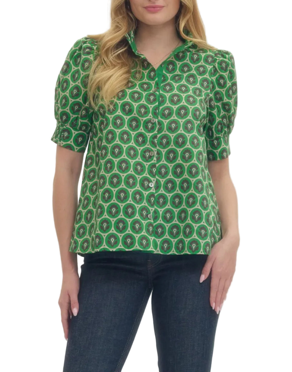 Geometric print short puff sleeve top featuring ruffled mock neck and button closure at front. Smocked cuffs. Unlined. Woven. Non-sheer. Lightweight.
