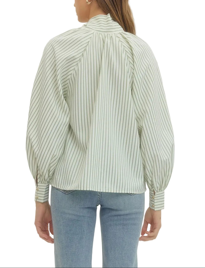 Elevate your everyday style with the Zoey Striped Long Sleeve Blouse, where timeless stripes meet modern charm. This versatile piece features a playful tie neck bow that adds instant personality to any outfit—dress it up for the office or down for weekend adventures. The long sleeves offer coverage and sophistication, while the classic striped pattern keeps things fresh and fun. Perfect for layering or wearing solo, this blouse is your new go-to for effortless style that works as hard as you do.