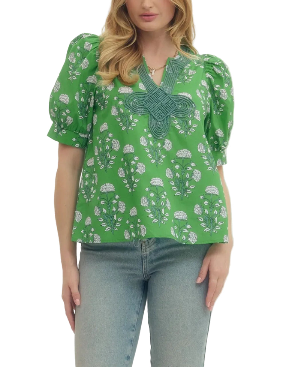 Floral print puff short sleeve top featuring V-neck with knotted applique detail. Unlined. Woven. Non-sheer. Lightweight.
