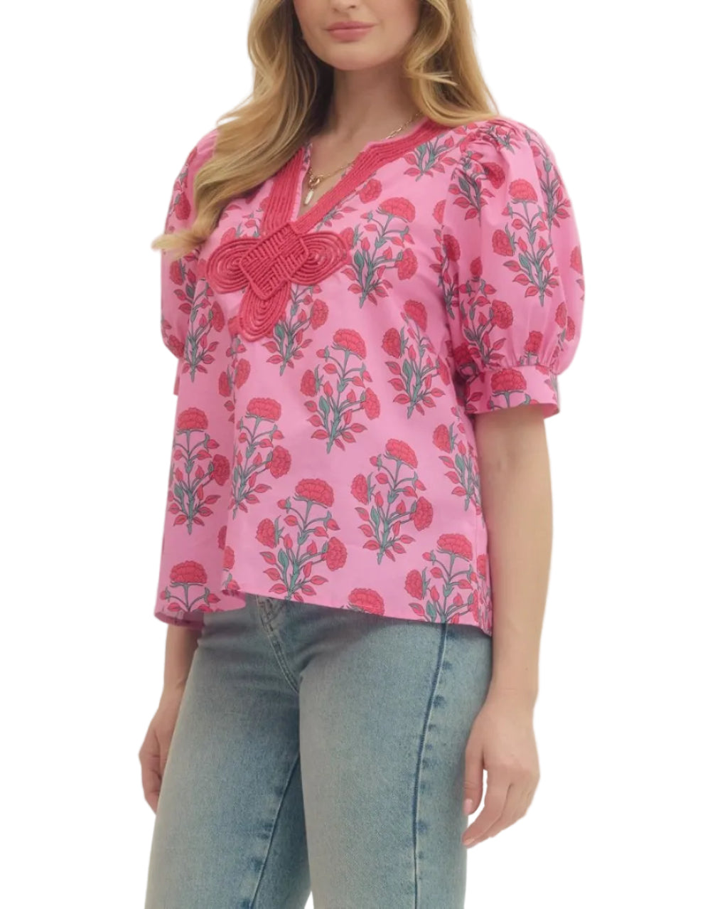 Floral print puff short sleeve top featuring V-neck with knotted applique detail. Unlined. Woven. Non-sheer. Lightweight.
