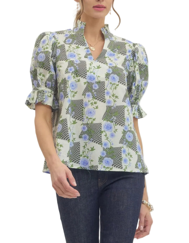 Printed top featuring mixed floral and geometric pattern. Short puff sleeve. Ruffled accent stand collar V-neck. Elasticated sleeve cuffs. Unlined. Woven. Non-sheer. Lightweight.