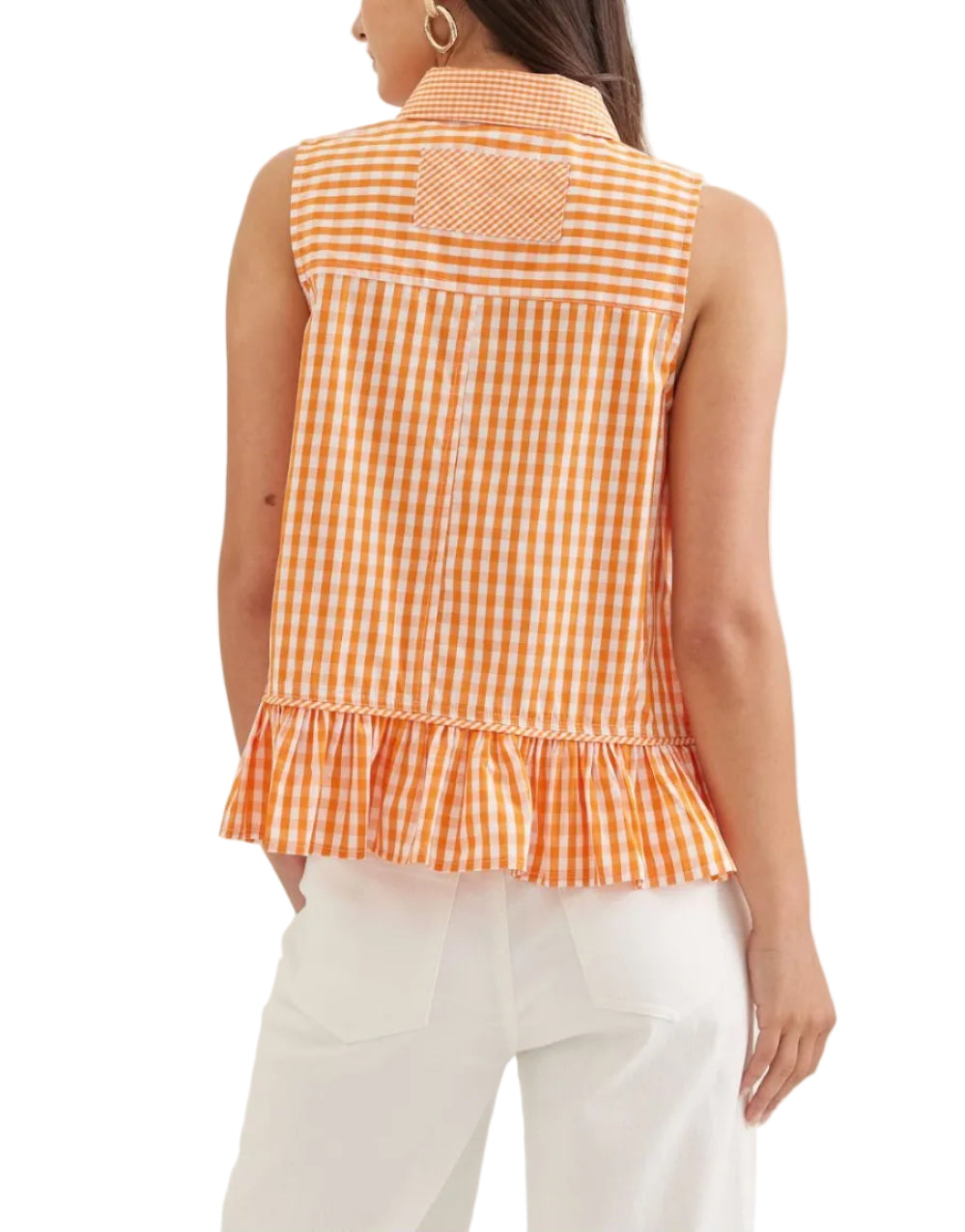Gingham sleeveless top featuring ruffle hem. Button closure at front. Collar. Front patch pocket. Back patch detail. Unlined. Woven. Non-sheer. Lightweight.