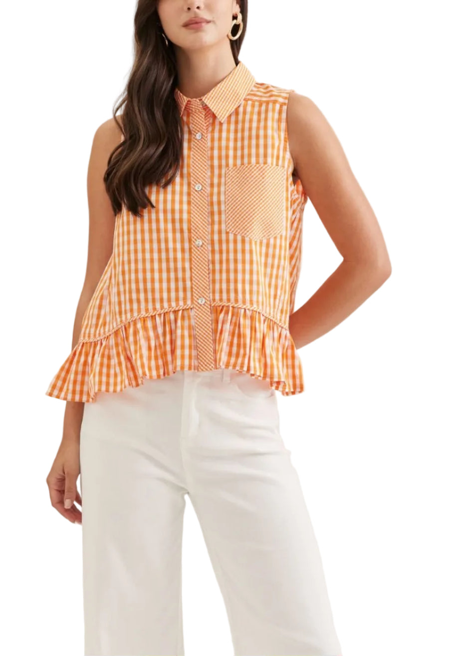 Gingham sleeveless top featuring ruffle hem. Button closure at front. Collar. Front patch pocket. Back patch detail. Unlined. Woven. Non-sheer. Lightweight.