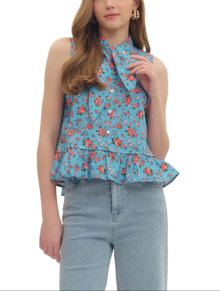 Floral print sleeveless top featuring pointed collar with self-tie detail and button closure at front. Peplum hem. Unlined. Woven. Non-sheer. Lightweight.
