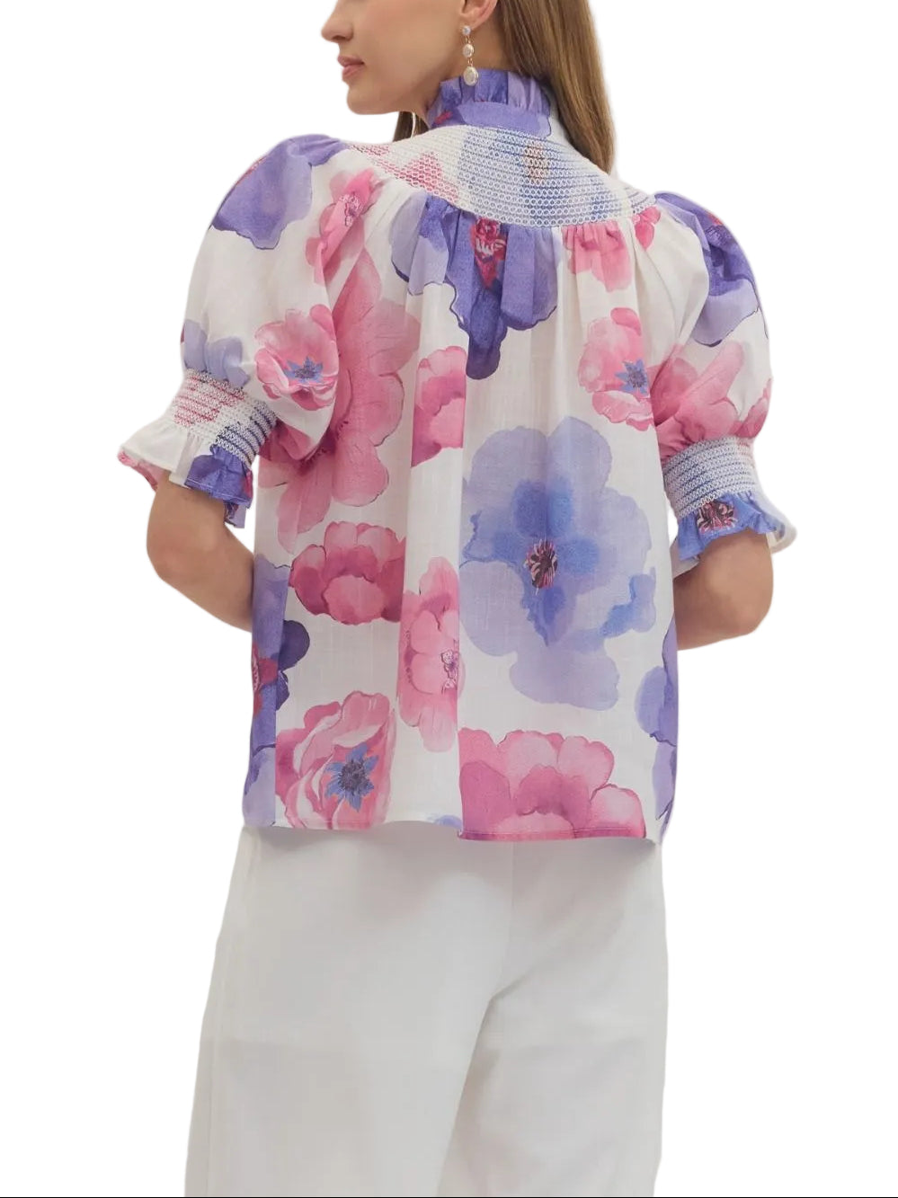 Floral print short puff sleeve top featuring smocked yoke panel. Button closure at front. Elasticated sleeve openings. Unlined. Woven. Non-sheer. Lightweight.