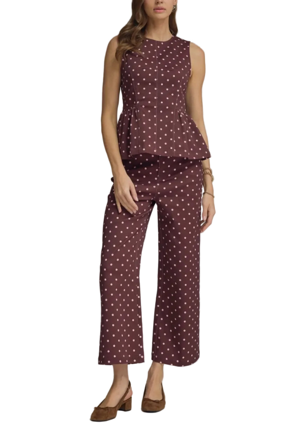 Polka dot sleeveless top featuring peplum hem detail. Back zipper closure. Unlined. Woven. Non-sheer. Lightweight