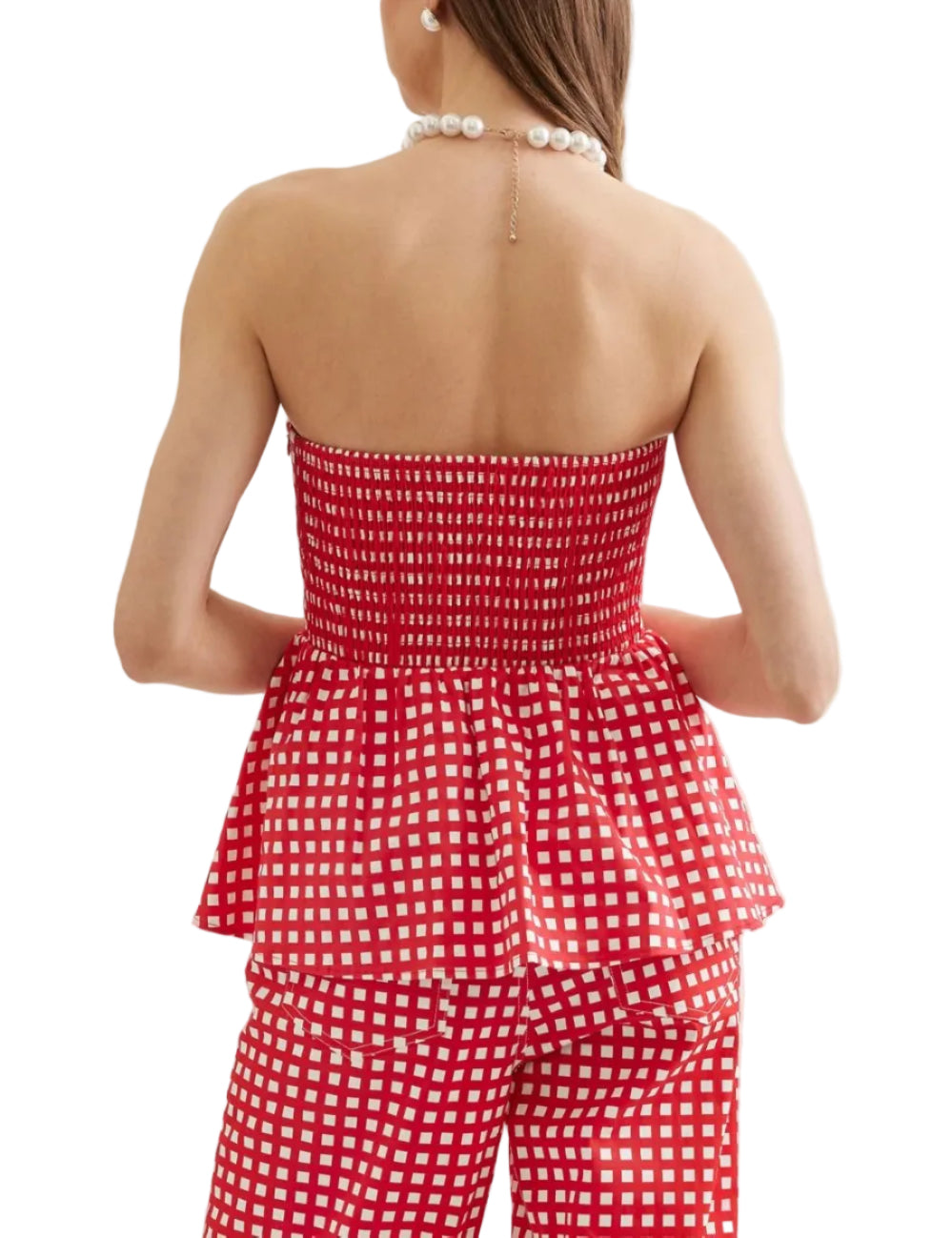 Checkered strapless peplum top featuring flared hem detail. Paired with matching bottoms. Unlined. Woven. Non-sheer. Lightweight. 100% Cotton