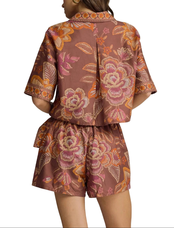 Botanical print wrap front skort featuring side tie detail. Elasticated waistband at back. Lined. Woven. Non-sheer. Lightweight.