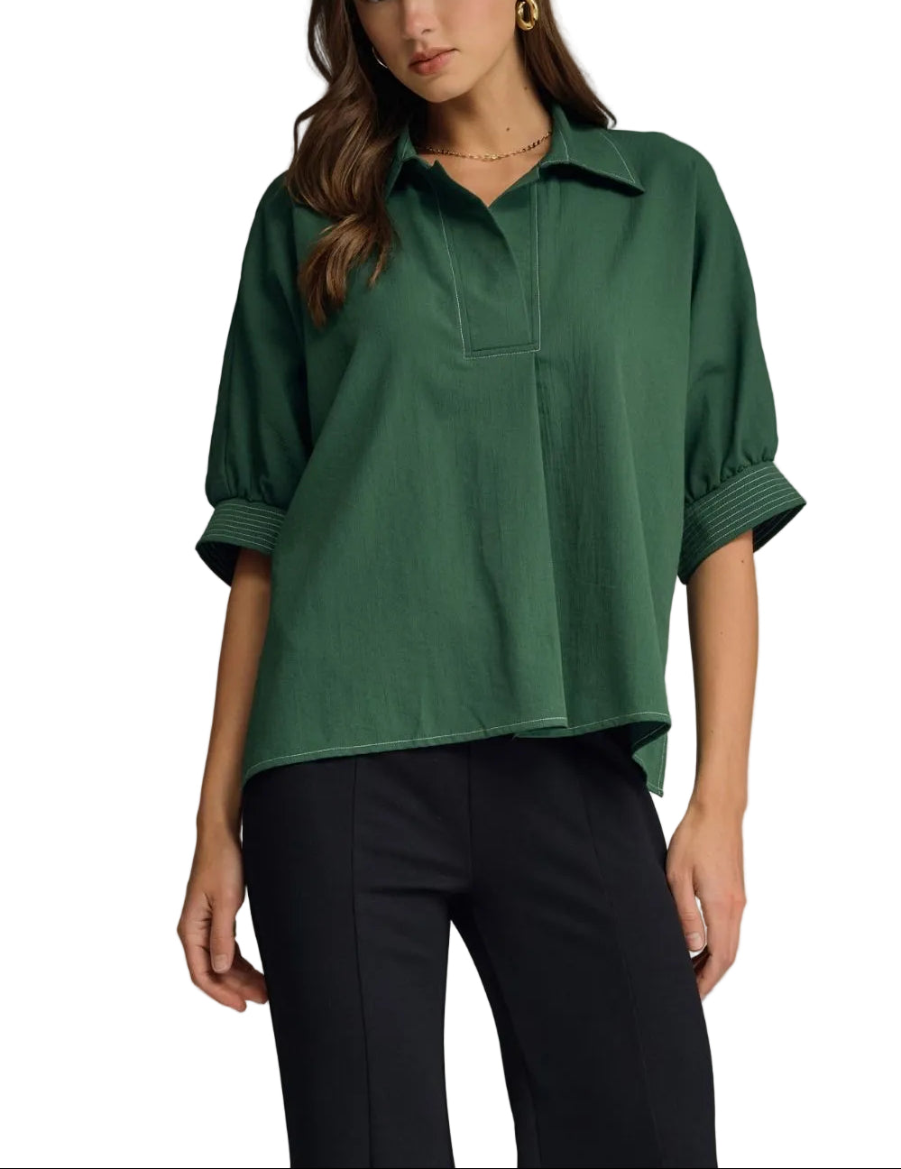 Solid short sleeve top featuring split V-neck collar. Contrast stitch detail at collar and cuffs. Side slits. Unlined. Woven. Non-sheer. Lightweight.