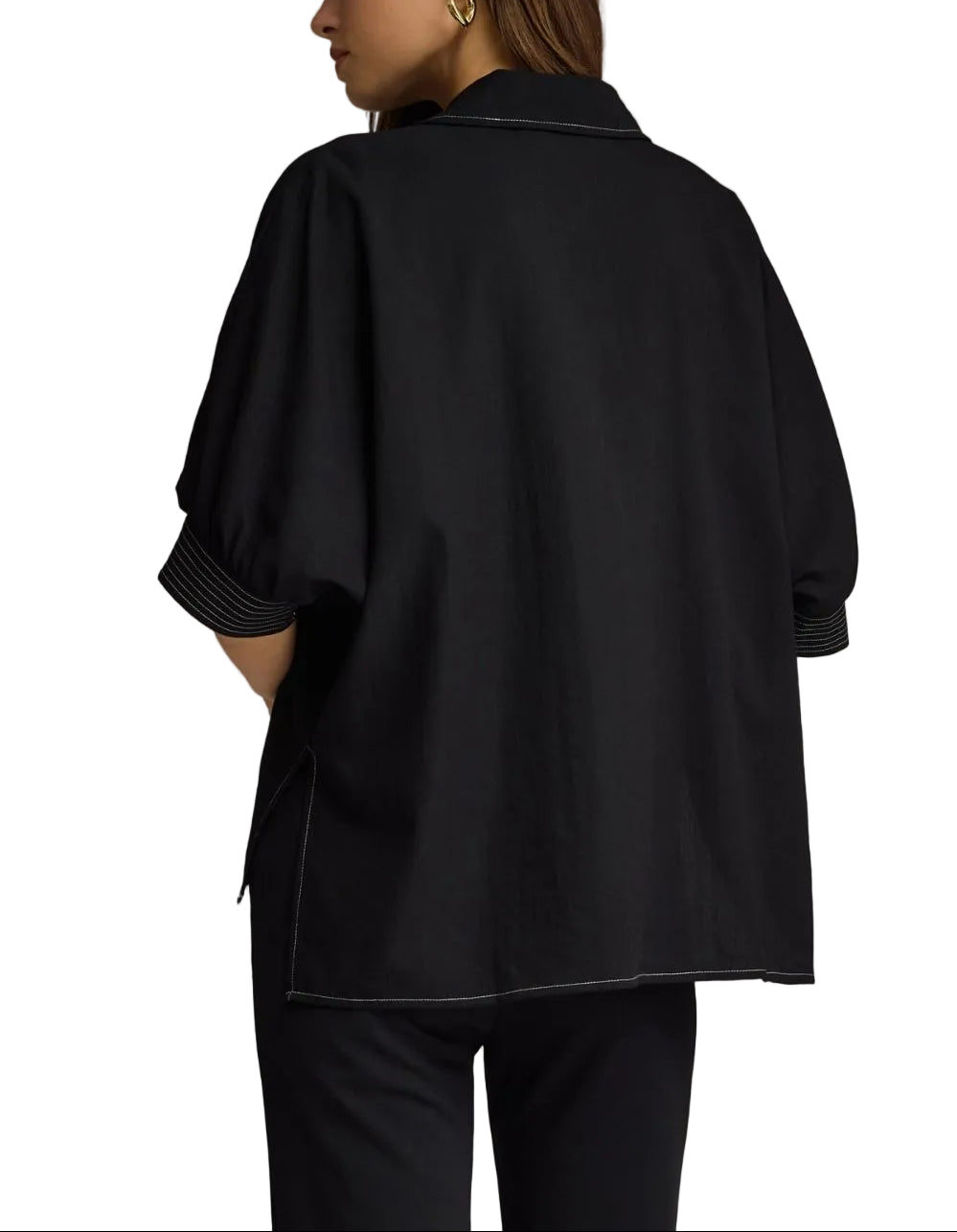 Solid short sleeve top featuring split V-neck collar. Contrast stitch detail at collar and cuffs. Side slits. Unlined. Woven. Non-sheer. Lightweight.