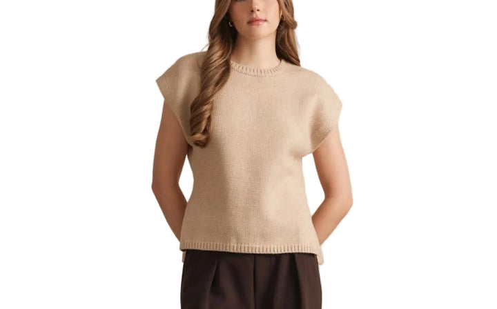 The Fiona Short Sleeve Sweater offers effortless layering for warm weather. Crafted from soft, breathable fabric, this versatile piece transitions seamlessly from office to weekend. The classic short sleeve design provides comfort without bulk, while the timeless silhouette pairs easily with jeans, skirts, or trousers. Perfect for spring and summer wardrobes.