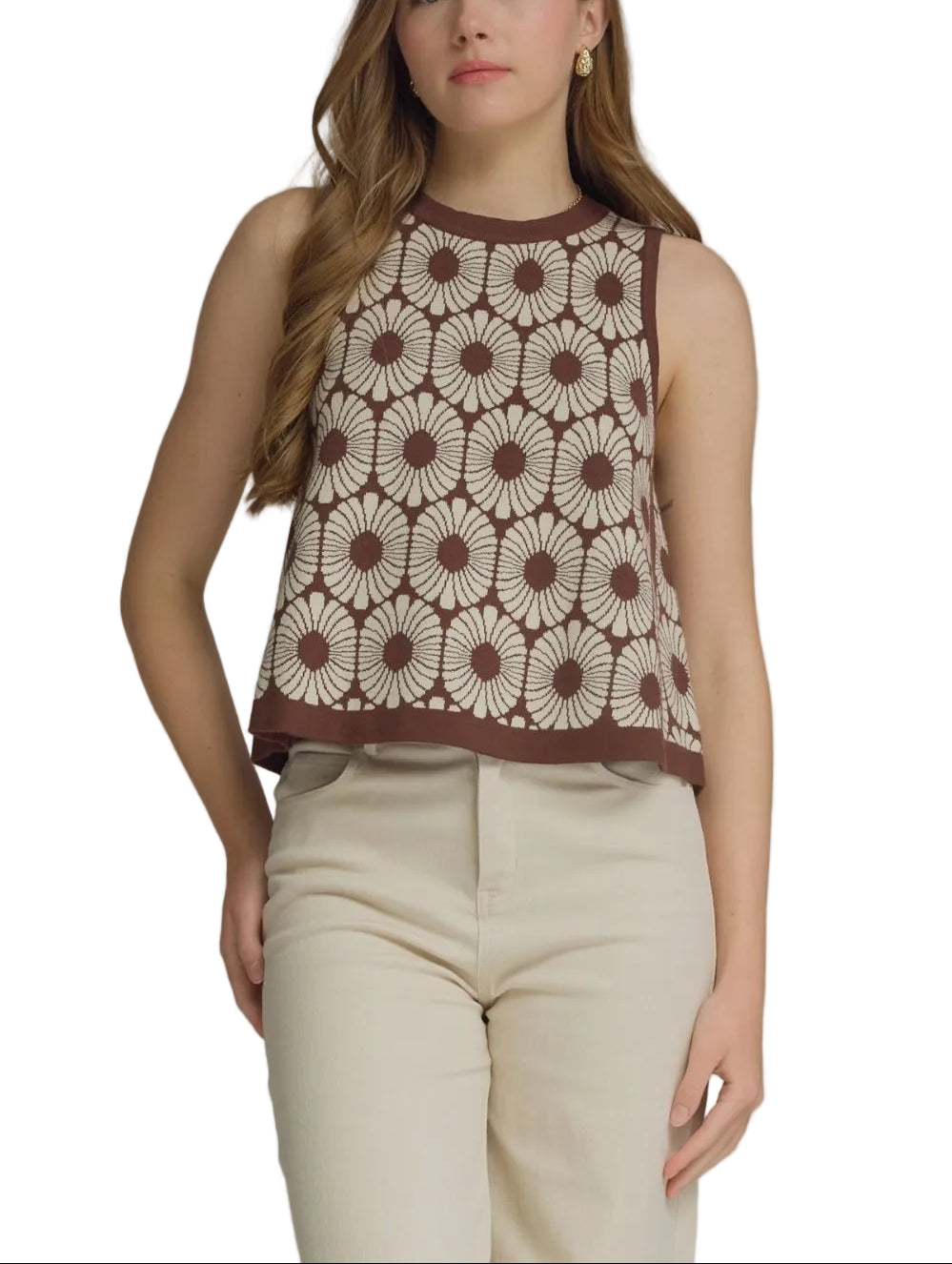 Elevate your warm-weather wardrobe with the Darla Floral Pattern Sleeveless Sweater. This lightweight knit features an all-over botanical print that brings effortless charm to any outfit. The sleeveless silhouette offers breathable comfort, making it perfect for layering over a crisp white tee or wearing solo on mild days. Crafted for versatility, it pairs beautifully with denim, linen pants, or skirts for a polished, relaxed look.