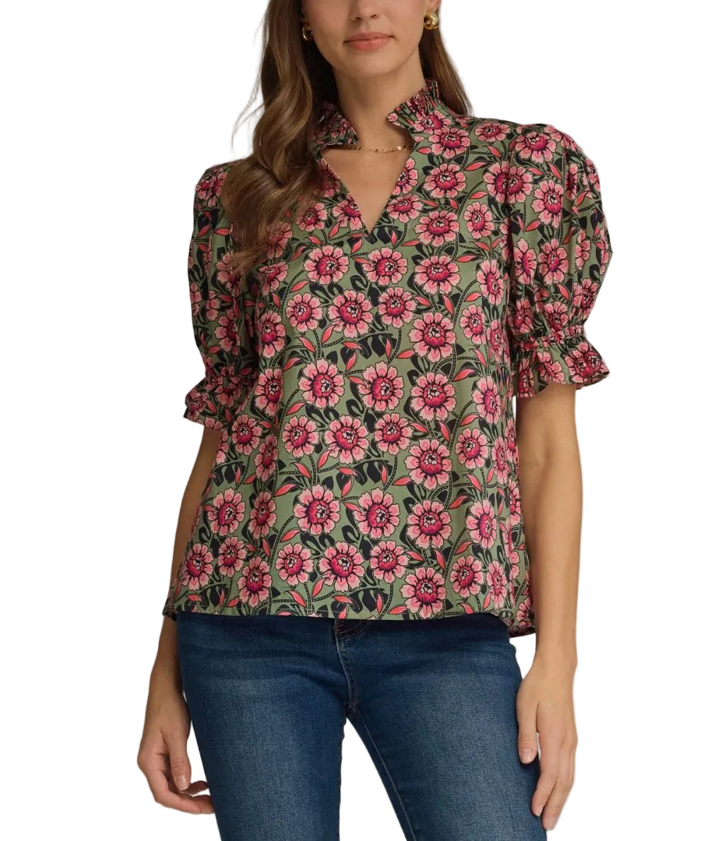 Floral elasticated short puff sleeve top featuring ruffled accent neck band collar V-neck. Elasticated ruffle sleeve hem. Unlined. Woven. Non-sheer. Lightweight.