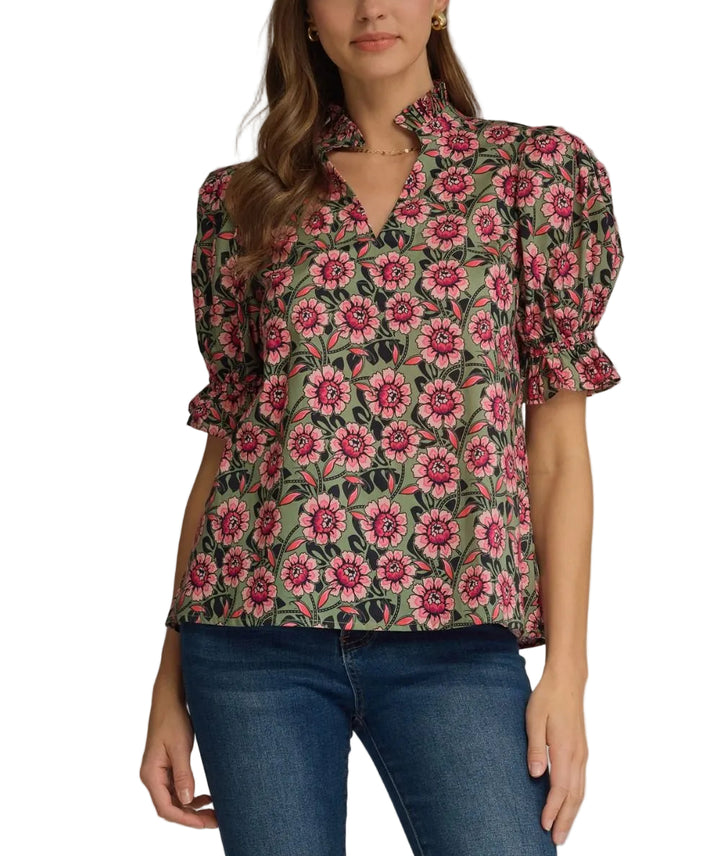 Floral elasticated short puff sleeve top featuring ruffled accent neck band collar V-neck. Elasticated ruffle sleeve hem. Unlined. Woven. Non-sheer. Lightweight.